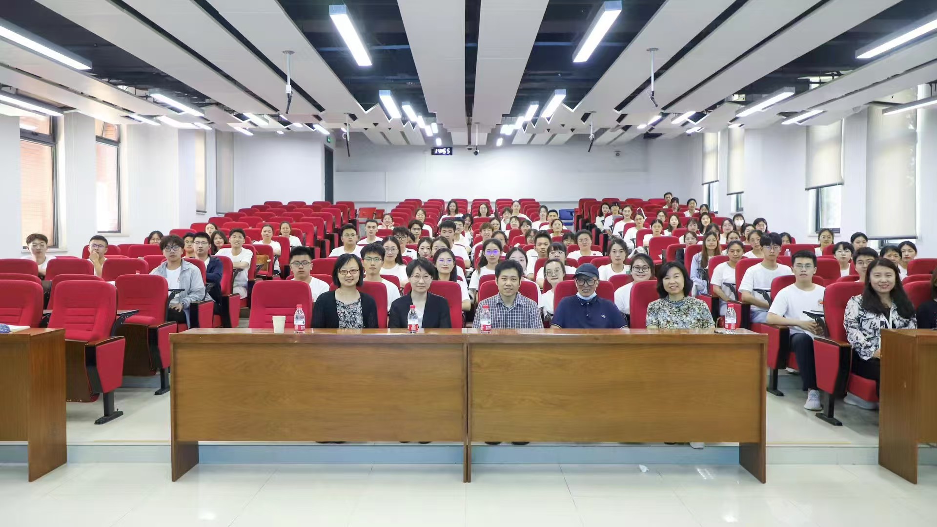 Group photo after a special report at the summer academic camp.